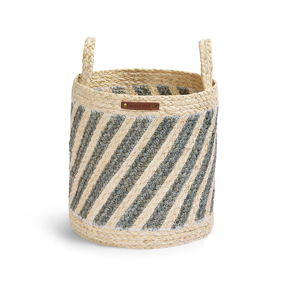 Woven basket with striped pattern and handle on a white background