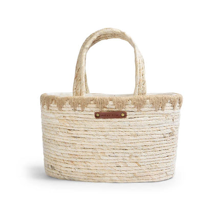 Woven handbag with a visible brand label on a white background