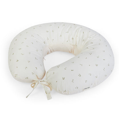 White baby boppy pillow with subtle pattern on a white background