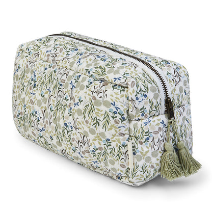 Floral patterned toiletry bag with tassels on a white background