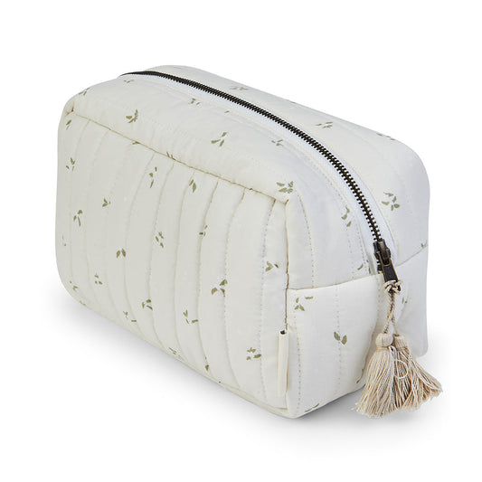 White quilted pouch with floral pattern and tassel on a white background
