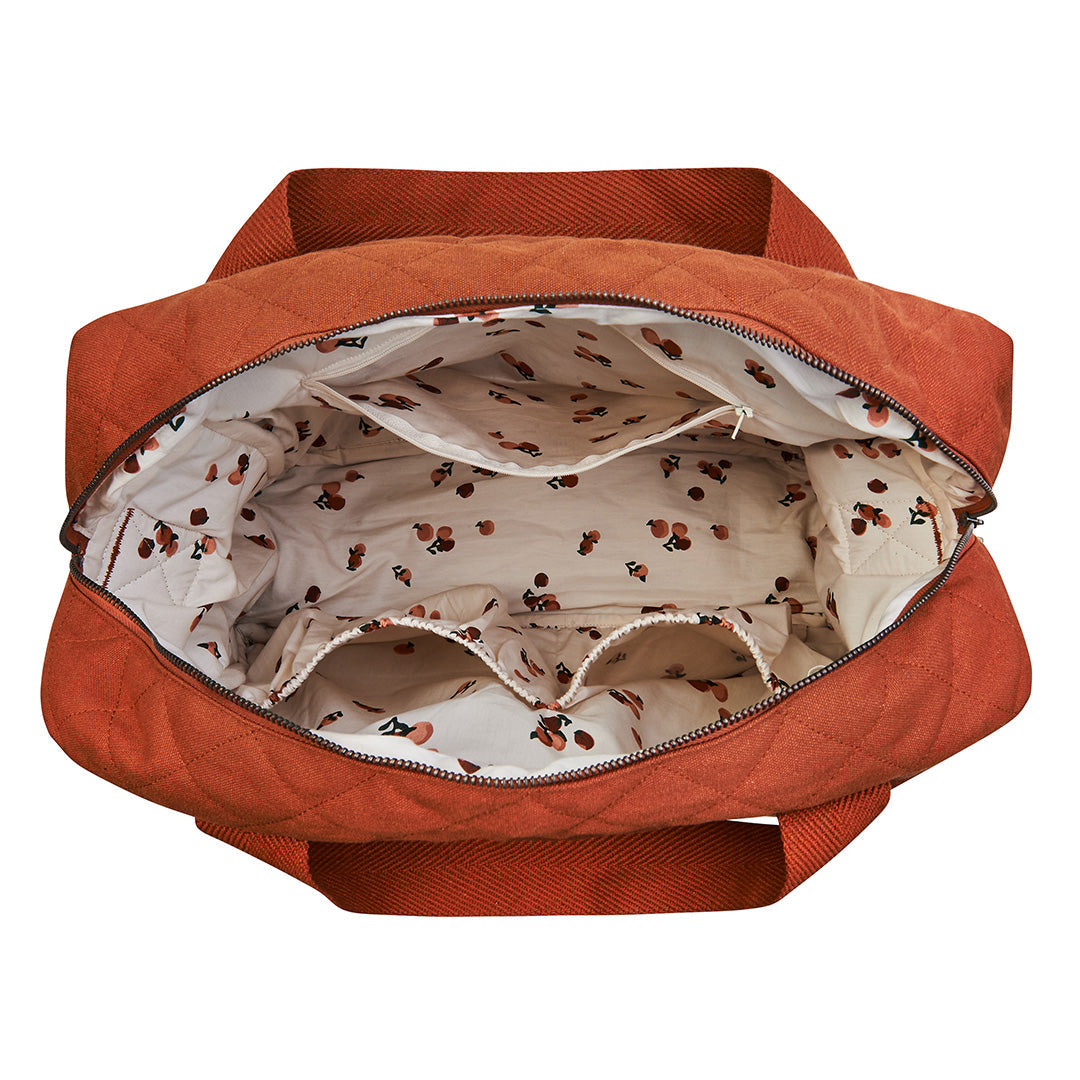Orange bag with a patterned interior on a white background