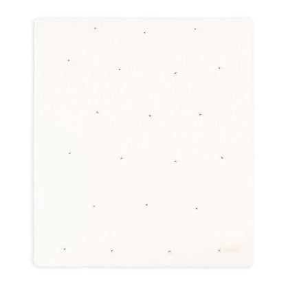 White square with subtle red speckles on a white background