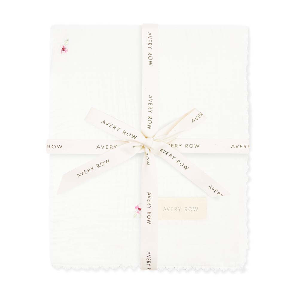 White fabric with 'Avery Row' branding pattern