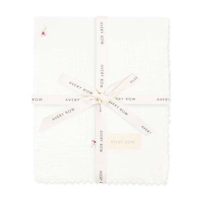 White fabric with 'Avery Row' branding pattern