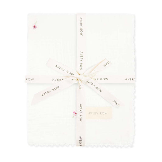 White fabric with 'Avery Row' branding pattern