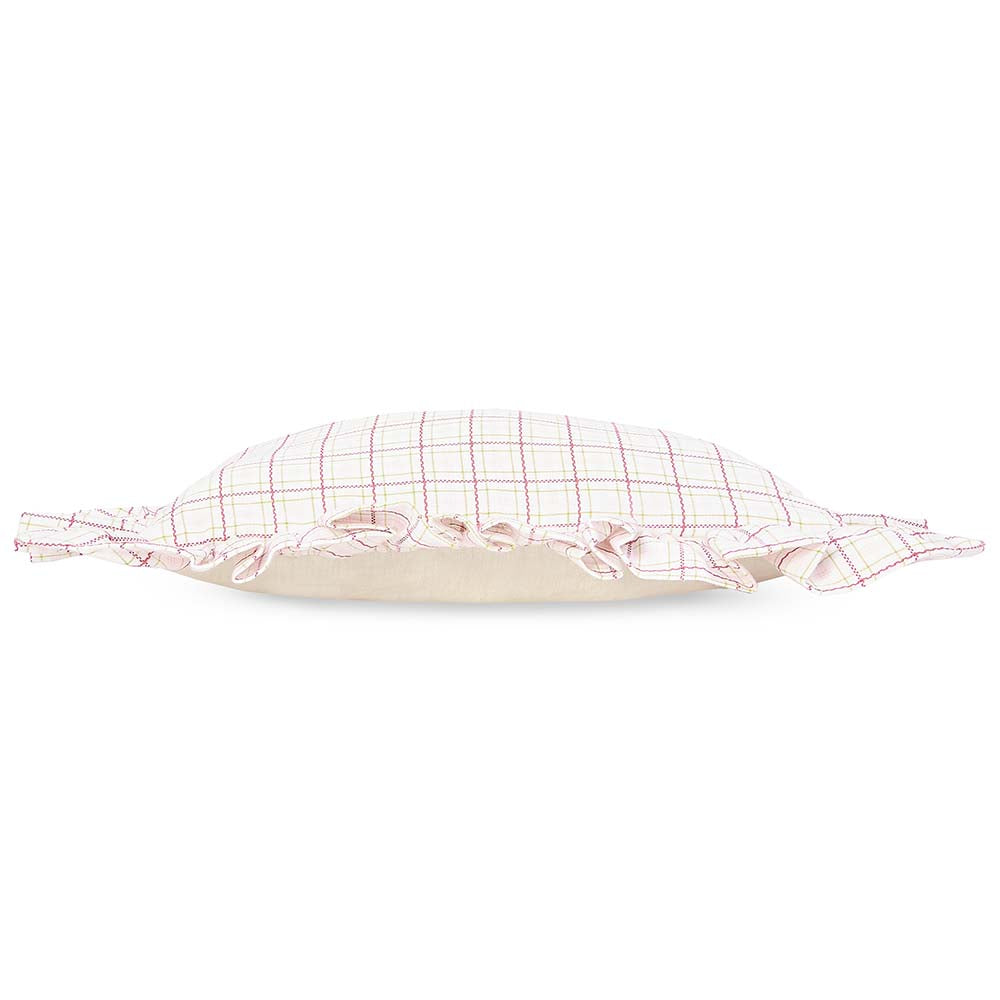 Checkered pillow with ruffle trim on a white background