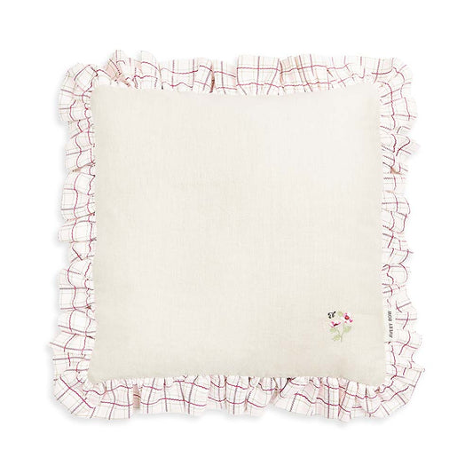 White pillow with red floral border on a white background