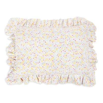 Floral patterned rug with ruffled edges on a white background