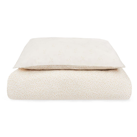 Folded beige blanket on a white background