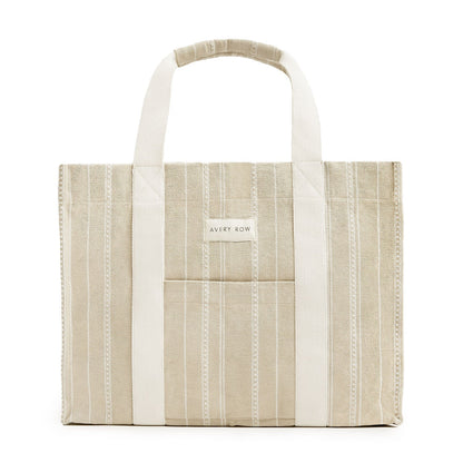 Beige and white striped tote bag with 'Avery Row' label on a white background