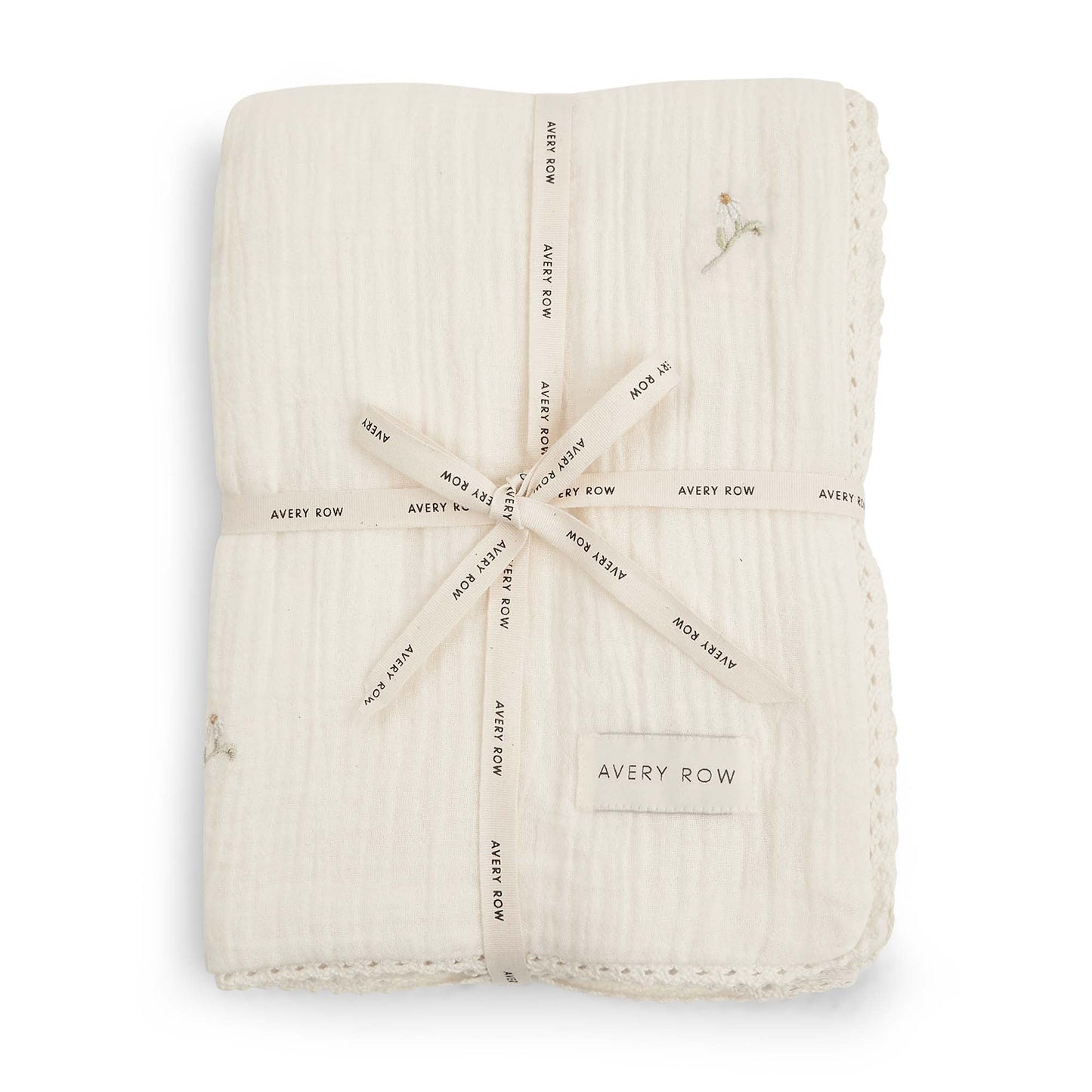 Folded beige fabric swaddle with 'Avery Row' branding on a white background