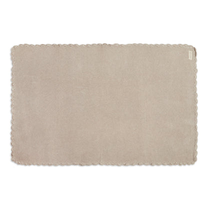 Beige woven placemat on a white background