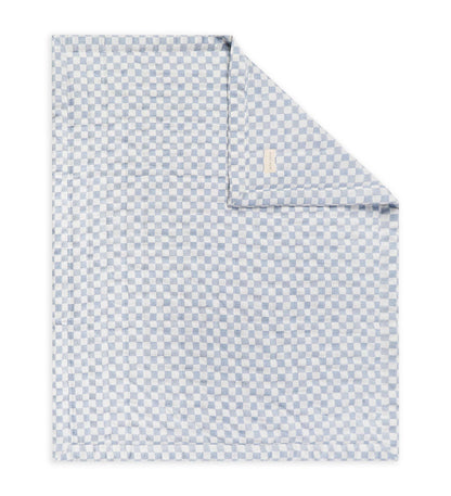 Blue patterned blanket on a white background