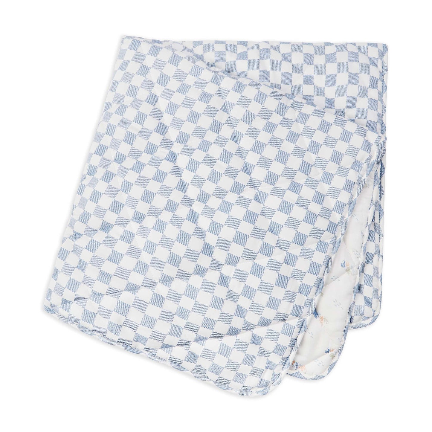Checkered blanket with blue and white pattern on a white background