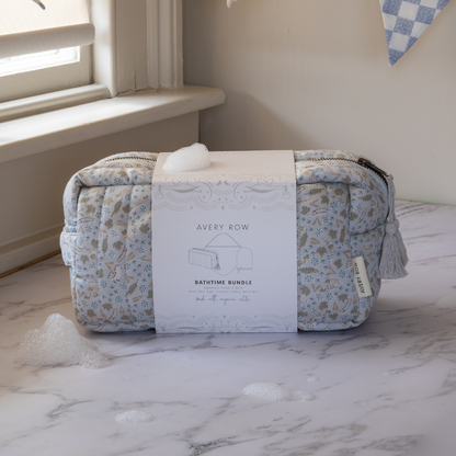 Baby product bundle with floral-patterned bag and box on a marble surface
