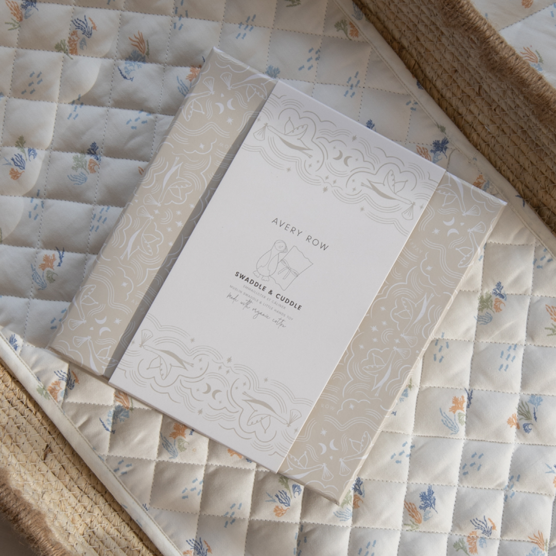 Stationery item with 'Avery Row' branding on a quilted surface