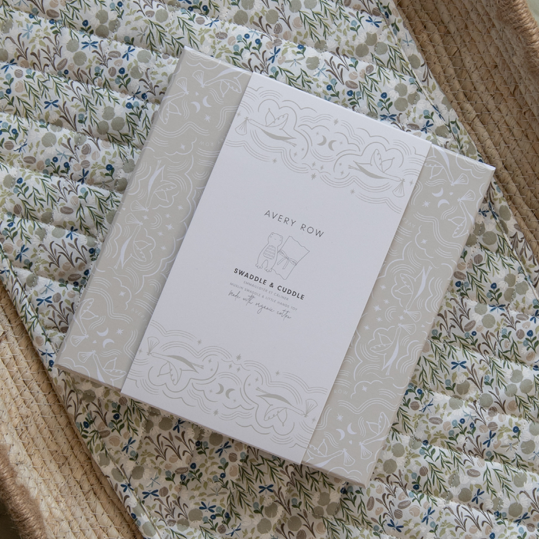 Product packaging with 'Avery Row' branding on a floral fabric background