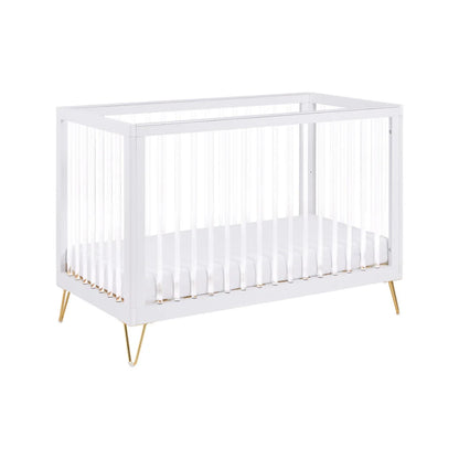 White crib with gold legs on a white background