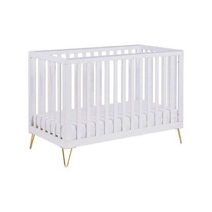 White crib with gold legs on a white background