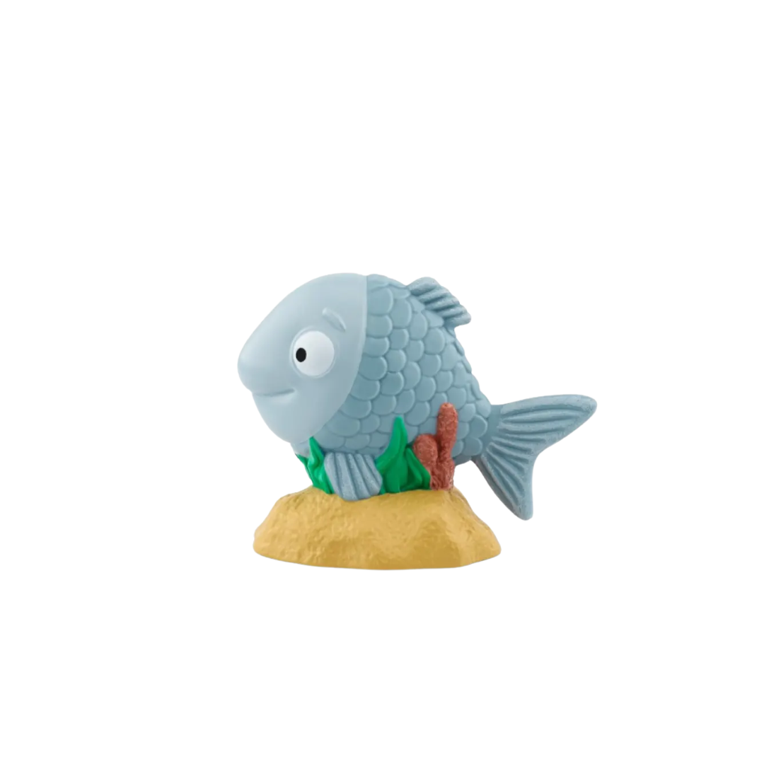 Toy fish with a sand base on a white background