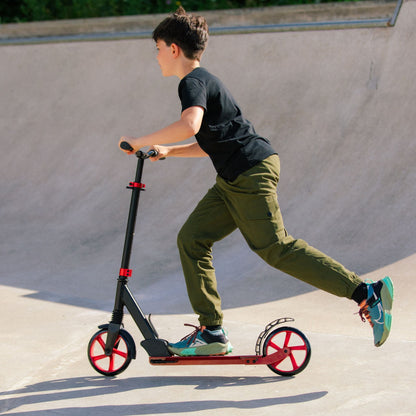 Person riding a scooter at a skate park