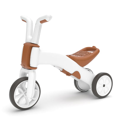 White and brown children's tricycle on a white background