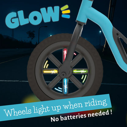 Children's balance bike with glowing wheels on a dark background, featuring the brand 'Glow'.