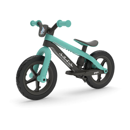 Turquoise and black balance bike on a white background