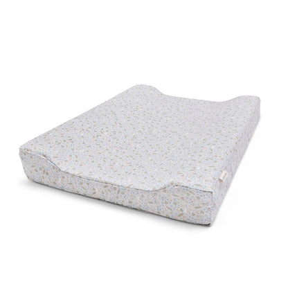 Gray textured changing pad on a white background