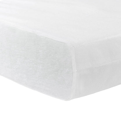 White fitted sheet on a bed with a plain background