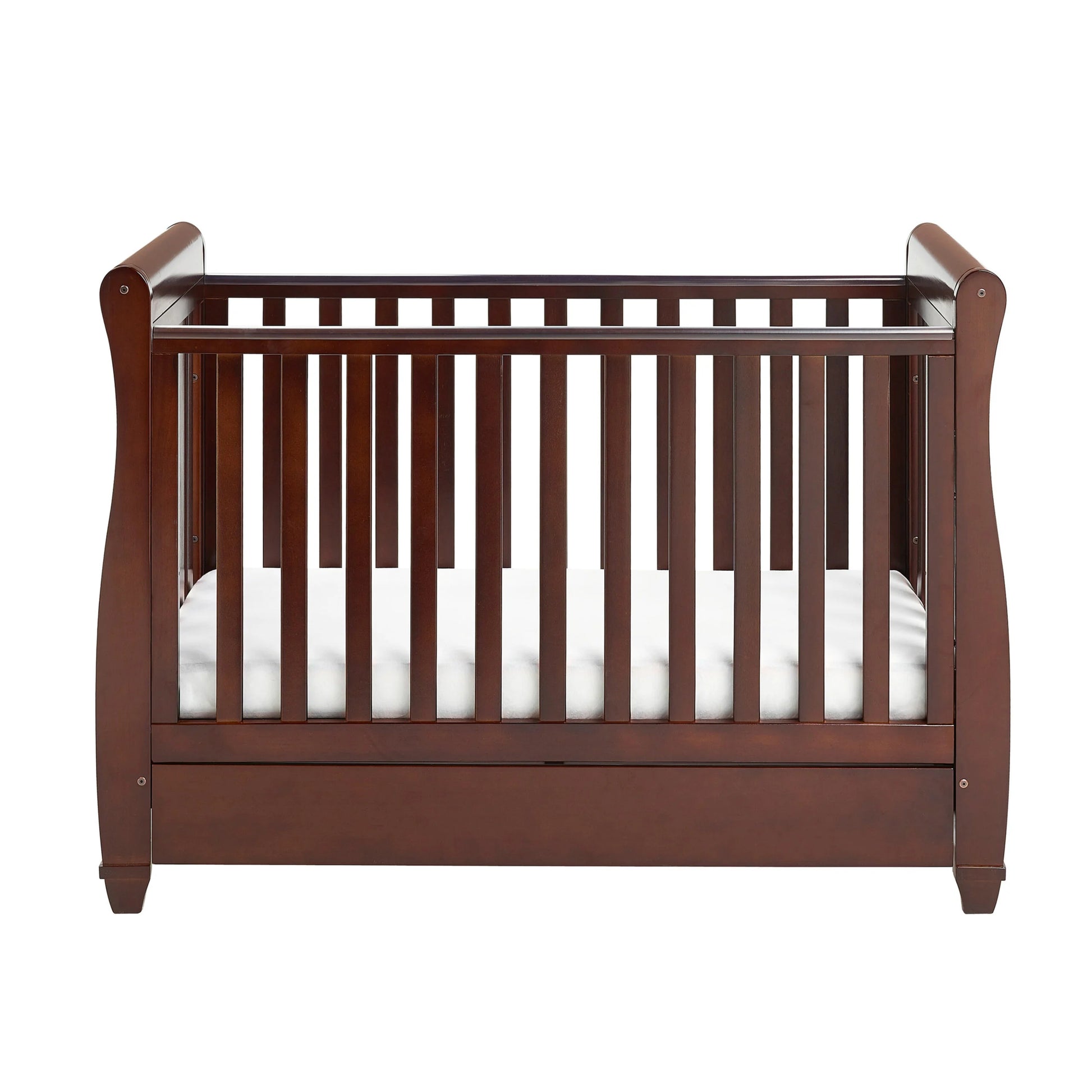 Wooden crib with white mattress on a white background