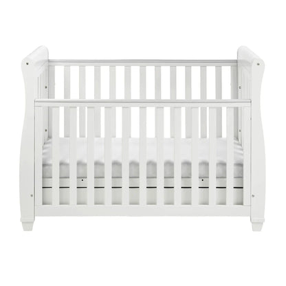 White crib with a white mattress on a white background