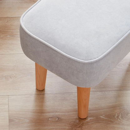 Gray stool with wooden legs on a wooden floor