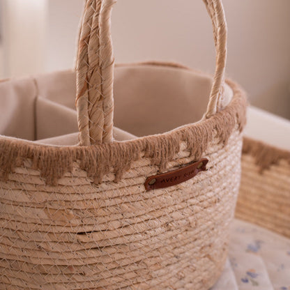 Close-up of a woven basket with a visible brand tag on a soft background