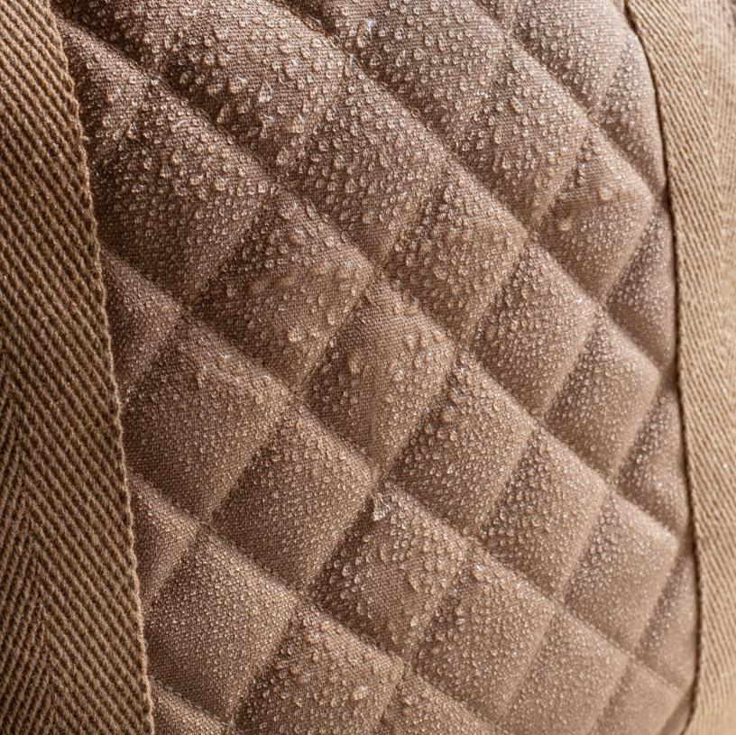 Close-up of a textured brown fabric with diamond pattern