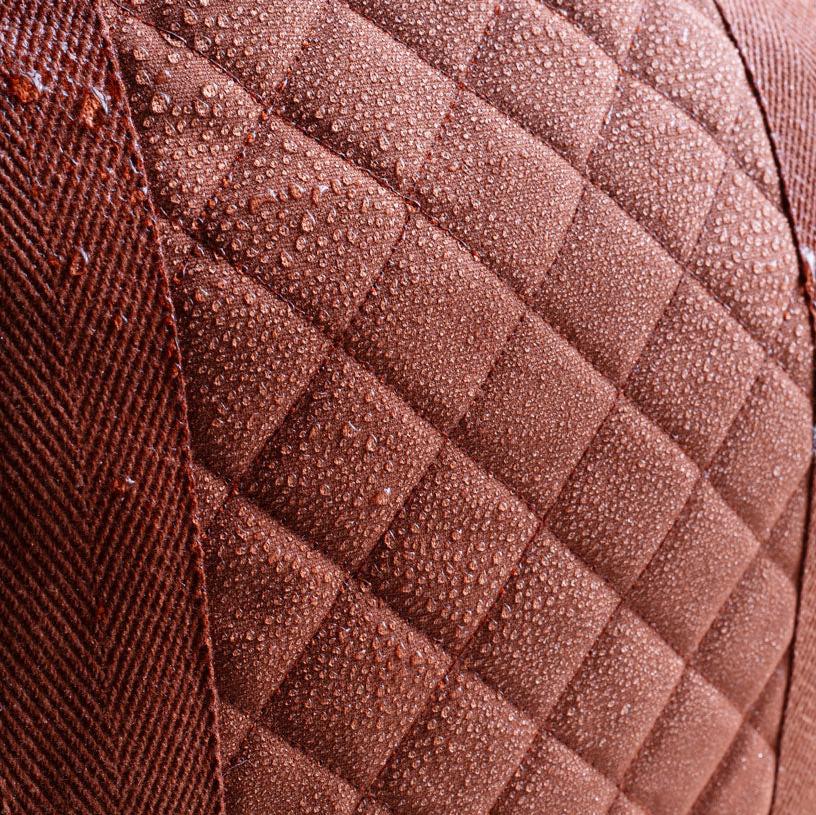 Close-up of a textured brown fabric with diamond pattern