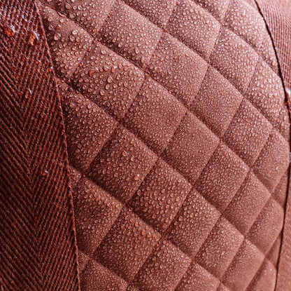Close-up of a textured brown fabric with diamond pattern