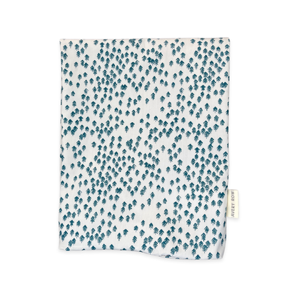 Fabric swatch with blue leaf pattern on a white background