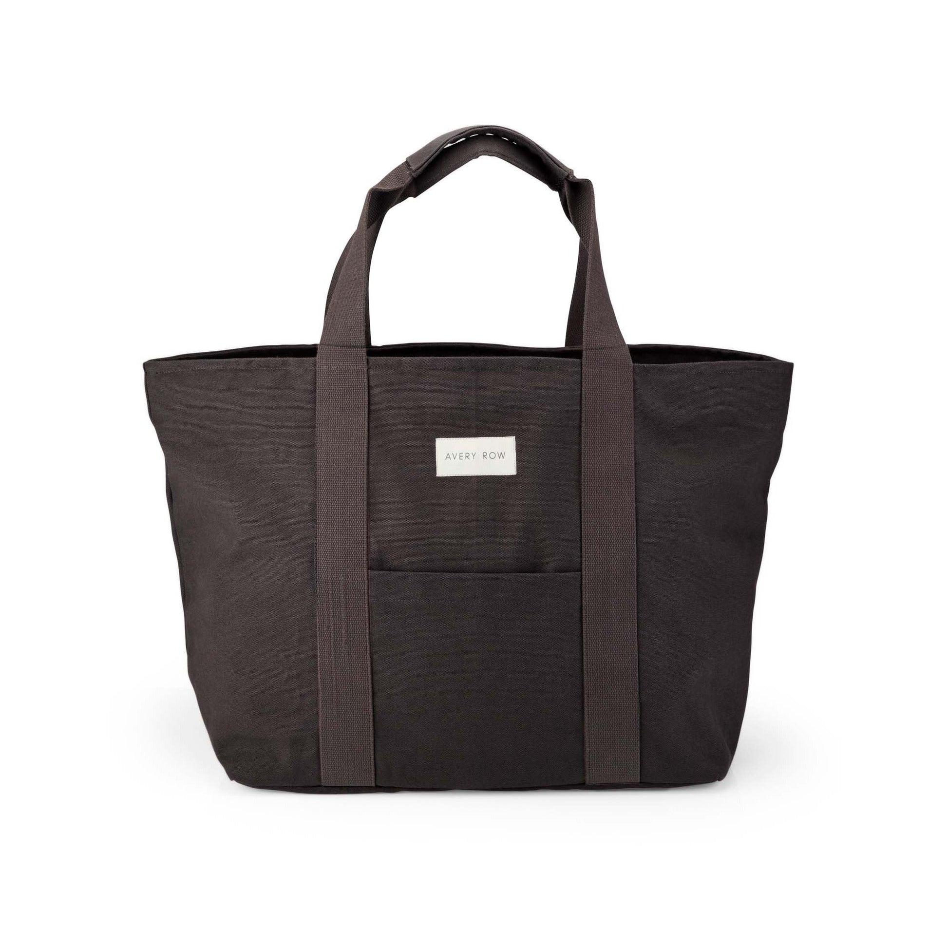 Black tote bag with a visible brand label on a white background