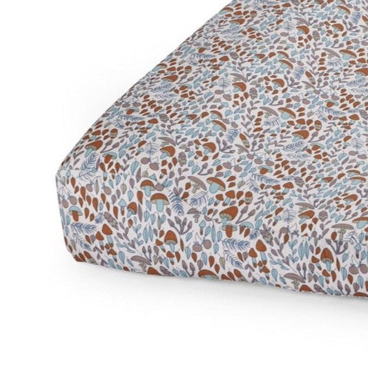 Patterned fabric with brown and blue design on a white background