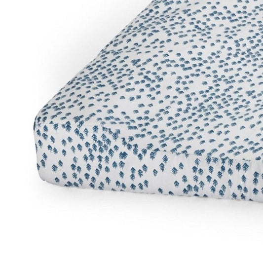 Fitted sheet with blue leaf pattern on a white background