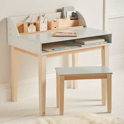 Children's desk with shelves and a chair in a room setting