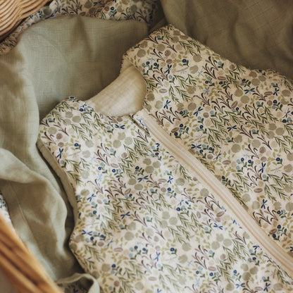 Floral-patterned fabric with a zipper on a textured surface