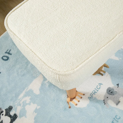 White cushion on a blue rug with animal prints