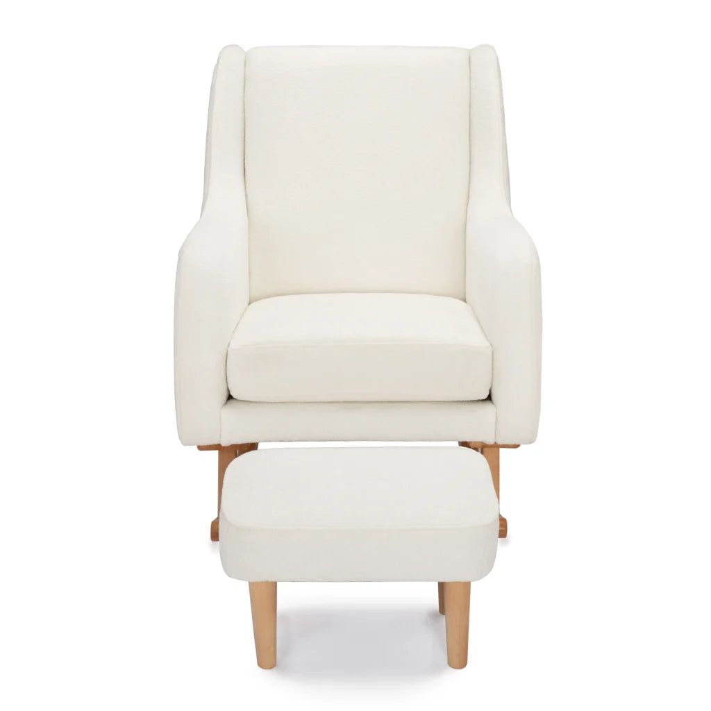 White armchair with matching ottoman on a white background