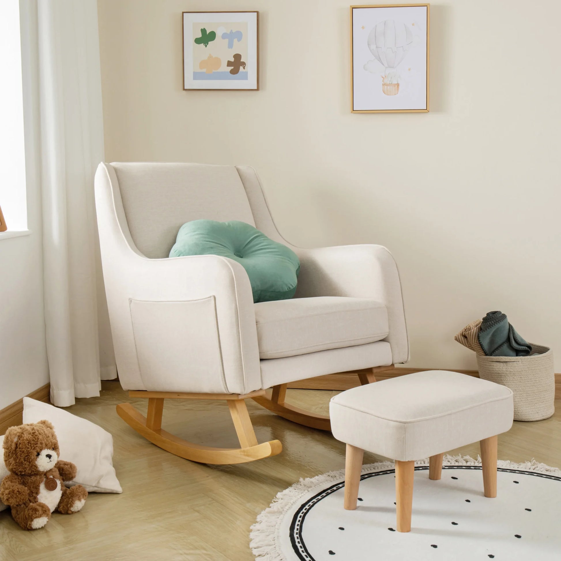 White rocking chair with a green cushion in a nursery setting