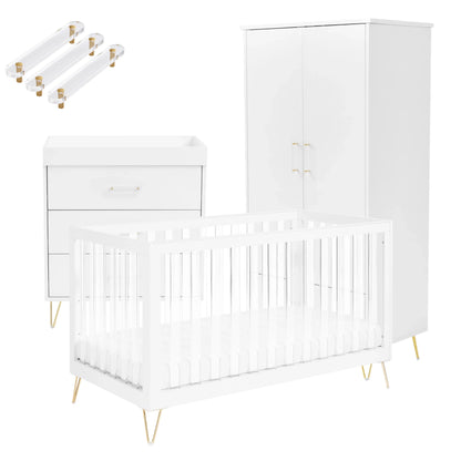 White crib with gold legs and matching changing table on a white background