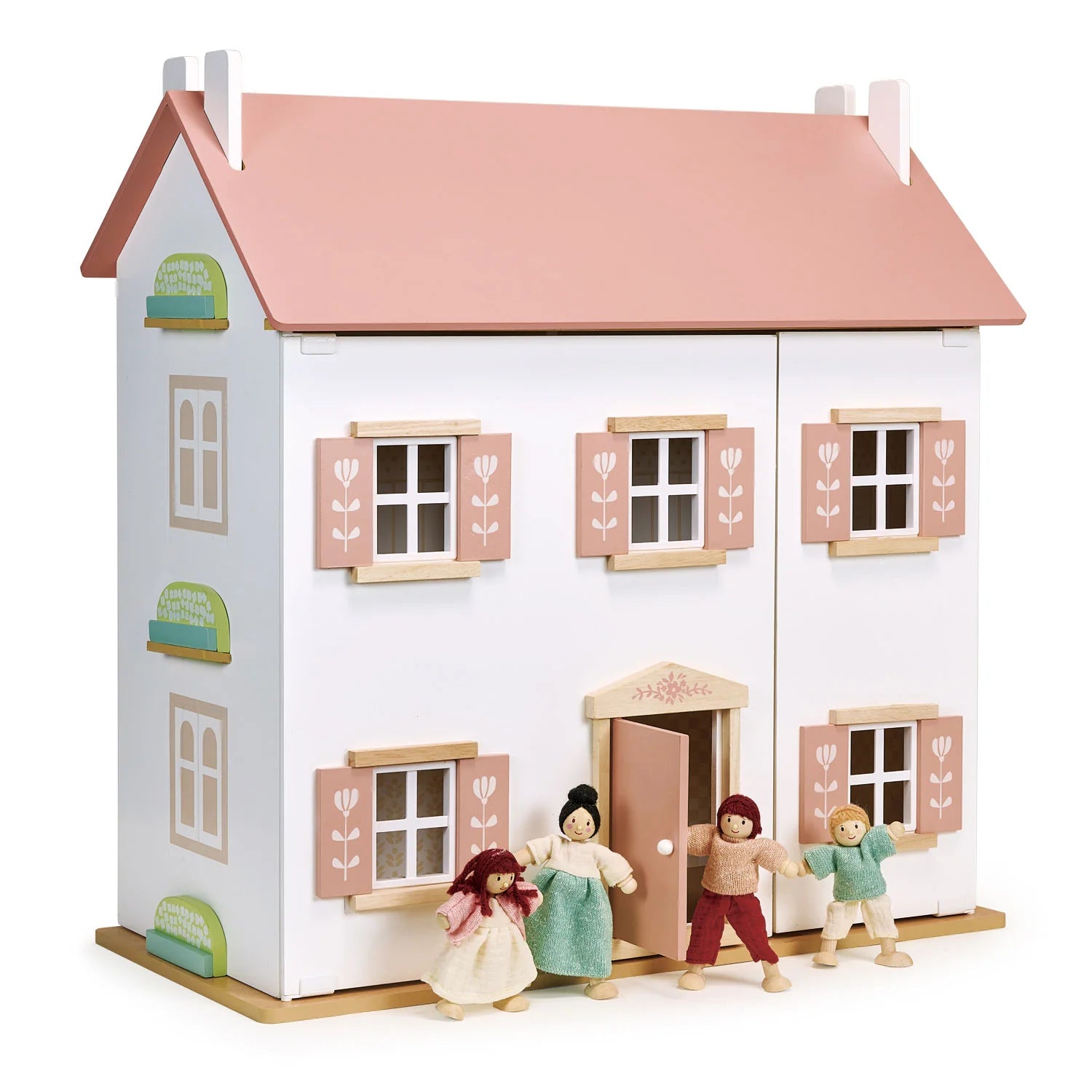Dollhouse with pink roof and four dolls in front on a white background