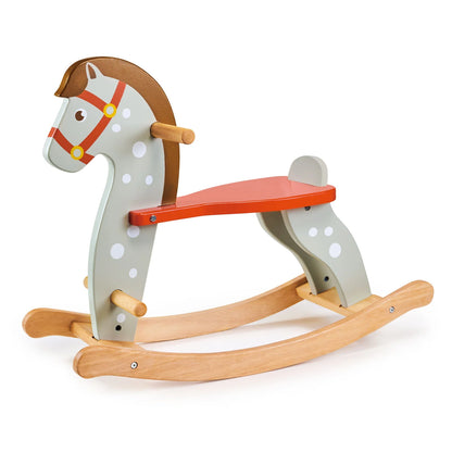 Wooden rocking horse with a red seat on a white background